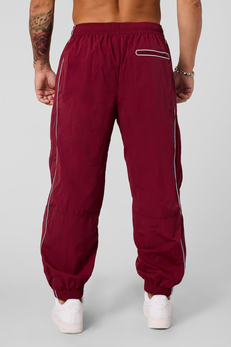 B2091 - Retro Cuffed Joggers - Relaxed, lightweight joggers with breathable fabric and cuffed hems. Perfect for training or everyday wear, with a versatile, retro-inspired silhouette in Burgundy.