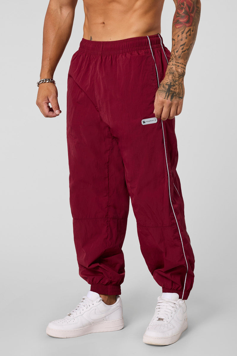 2091 - Retro Cuffed Joggers - Relaxed, lightweight joggers with breathable fabric and cuffed hems. Perfect for training or everyday wear, with a versatile, retro-inspired silhouette in Burgundy.