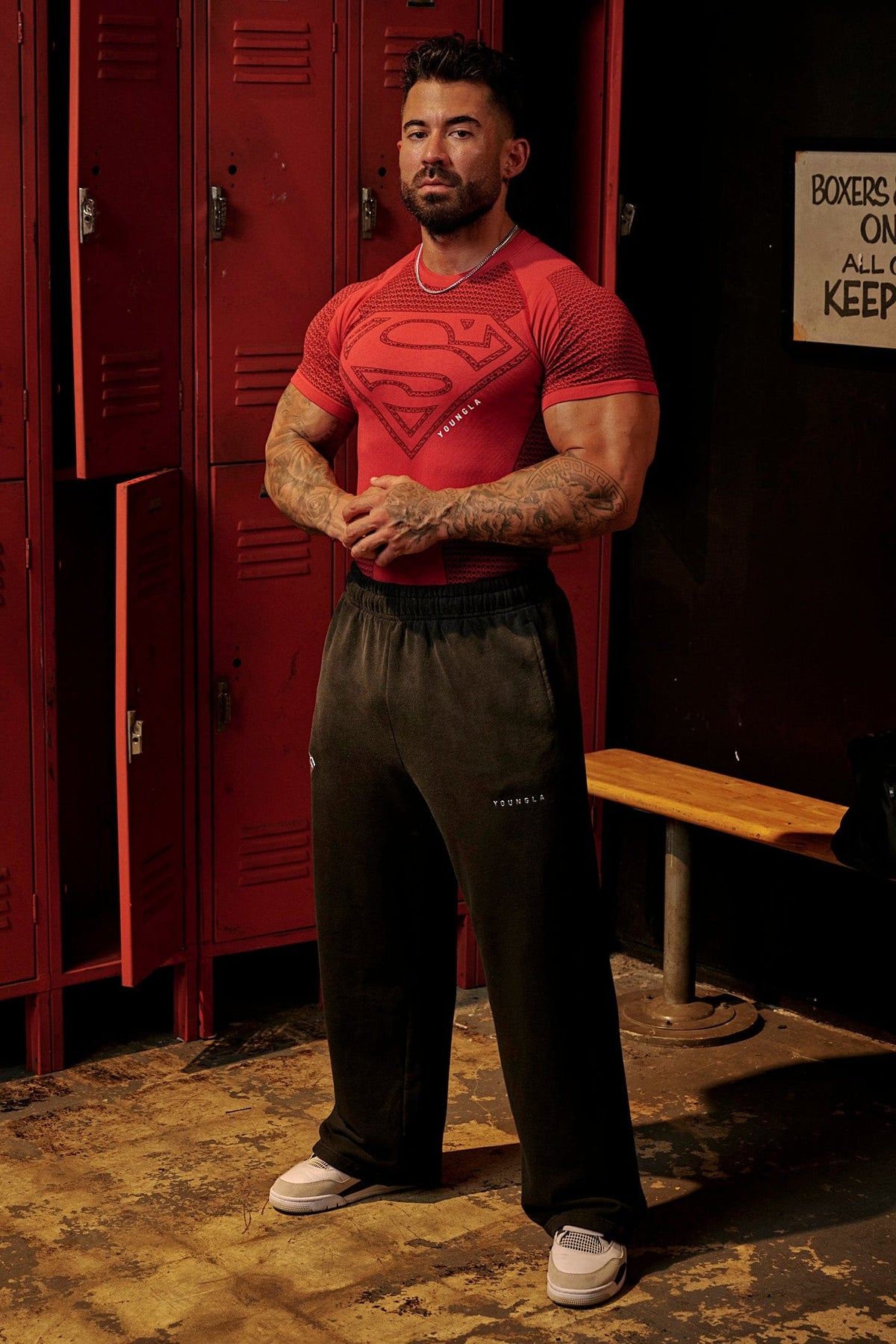 2032 - Superman Sweats - Man of Steel sweatpants from Superman x YoungLA collaboration, acid-wash design, YoungLA chrome logo on left leg, Superman logo on right, baggy fit for comfortable everyday wear in Red Wash
