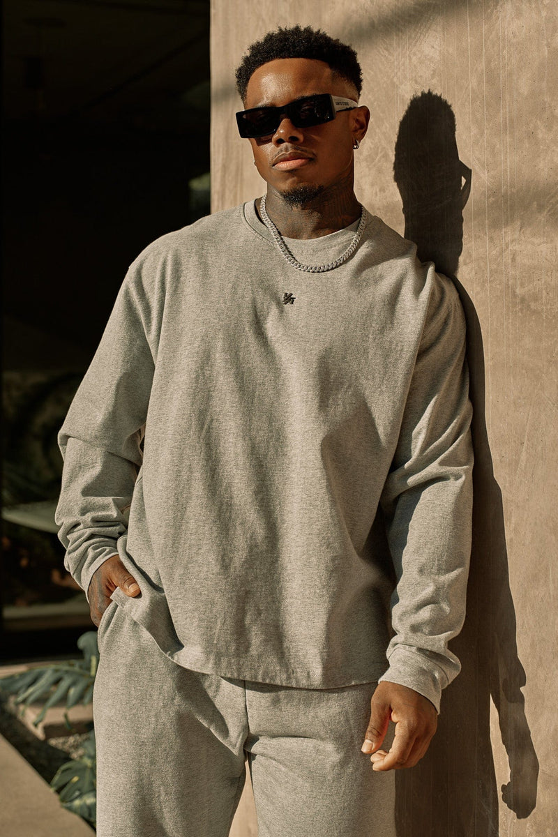 8001 - Elevated Essentials - Longsleeves -  Midweight cotton long sleeve with ribbed cuffs and minimal 'Elevated' branding. Durable, comfortable, and perfect for year-round wear in Heather Grey.