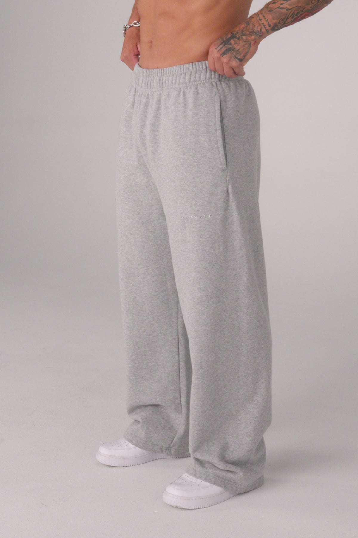 2032 - Superman Sweats - Man of Steel sweatpants from Superman x YoungLA collaboration, acid-wash design, YoungLA chrome logo on left leg, Superman logo on right, baggy fit for comfortable everyday wear